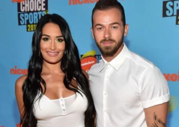 Artem Chigvintsev and Nikki Bella exchange vows in a picturesque Paris wedding.