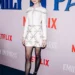 Lily Collins Shines at the “Emily in Paris” Season 3 Premiere in a White Bow Mini Dress and Towering Platforms