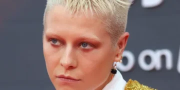 At the Golden Globes, Their Glitter Tear Matches Emma D’Arcy’s Blue Hair.